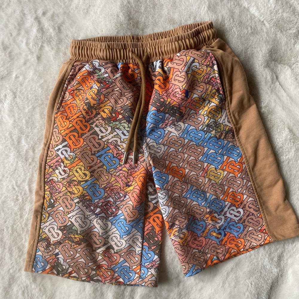 Boys size 10 knit colorful print shorts with an elastic waistband.